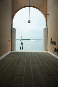 Building by sea against sky