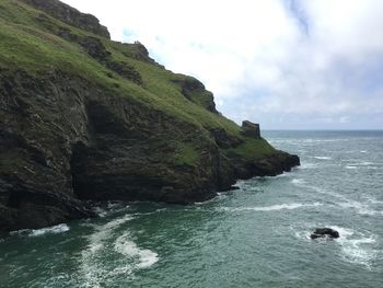 Scenic view of sea against cloudy sky