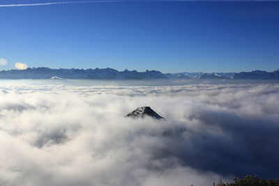 Low angle view of mountain against blue sky