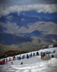 Scenic view of mountains against cloudy sky