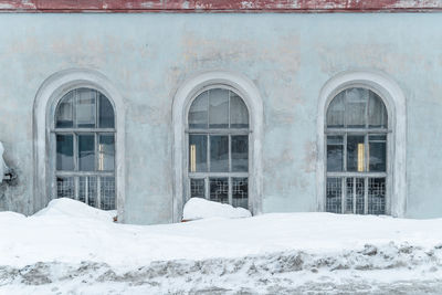 White building covered with snow