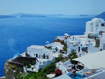 High angle view of buildings by sea