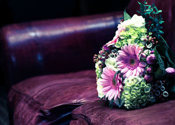 Close-up of flower bouquet on sofa