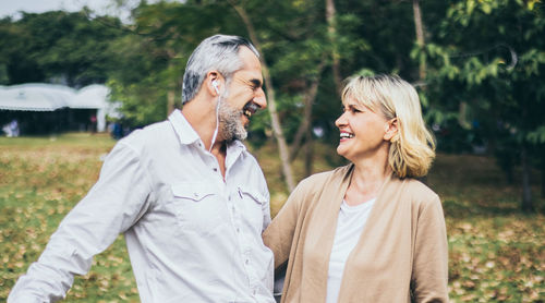 Cheerful couple standing outdoors