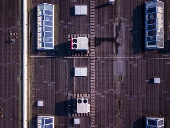 Directly above shot of buildings in city during sunny day