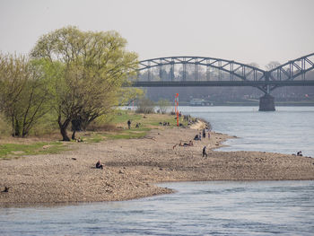 View of bridge over river against clear sky