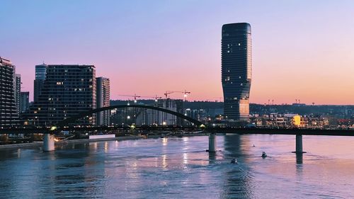Belgrade waterfront. illuminated bridge over river in city.