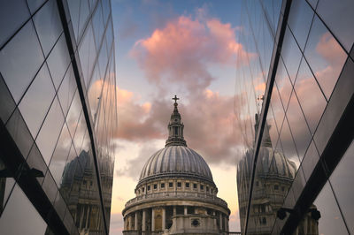 Low angle view of buildings against sky during sunset