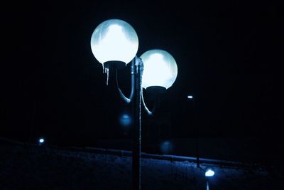 Low angle view of illuminated street light