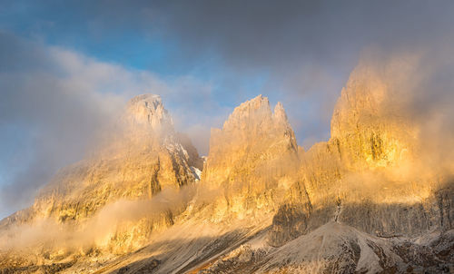 Panoramic view of snowcapped mountains against sky