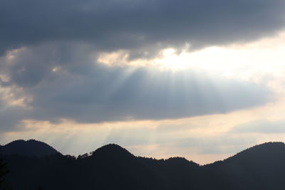 Low angle view of silhouette mountain against sky during sunset