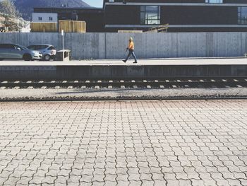 Full length of woman walking in city