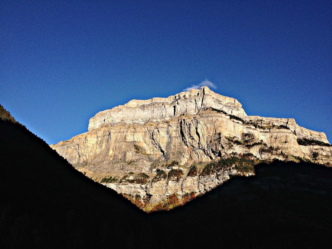 clear sky, blue, copy space, rock formation, geology, tranquility, low angle view, tranquil scene, physical geography, nature, scenics, mountain, eroded, beauty in nature, rock - object, rocky mountains, arid climate, landscape, rough, desert