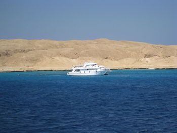 Boats sailing in sea