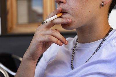 Close-up of man smoking electronic cigarette