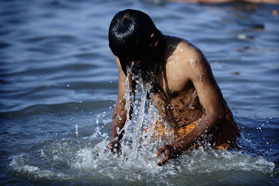 Man swimming in sea