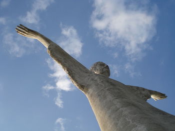 Low angle view of cristo redentore against blue sky