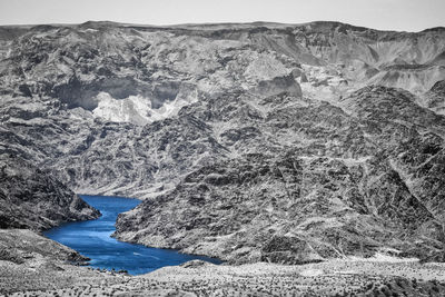 Desert mountains with a blue reservoir lake