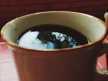 Close-up of coffee cup on table