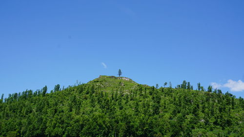 Scenic view of mountains against clear blue sky