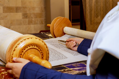 High angle view of person by torah at synagogue