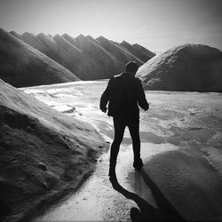 Man standing on sand