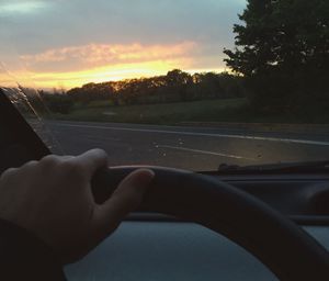 Cropped image of car on road