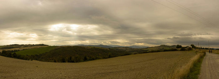 Scenic view of landscape against cloudy sky