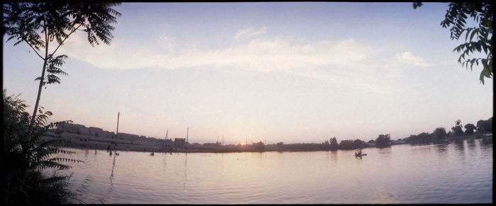 Scenic view of sea against sky at sunset