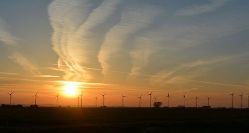 Scenic view of silhouette landscape against sky during sunset