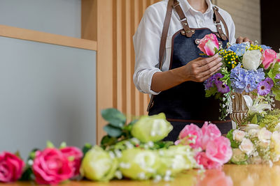 Woman holding flower bouquet