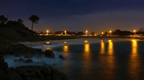 Reflection of illuminated buildings in water
