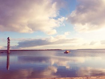 Scenic view of sea against cloudy sky