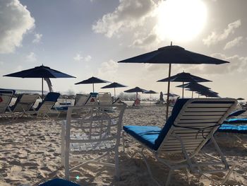 Lifeguard hut on beach against sky