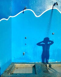 Full length of man standing in swimming pool