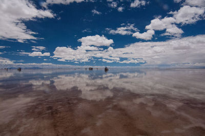 Scenic view of landscape against cloudy sky