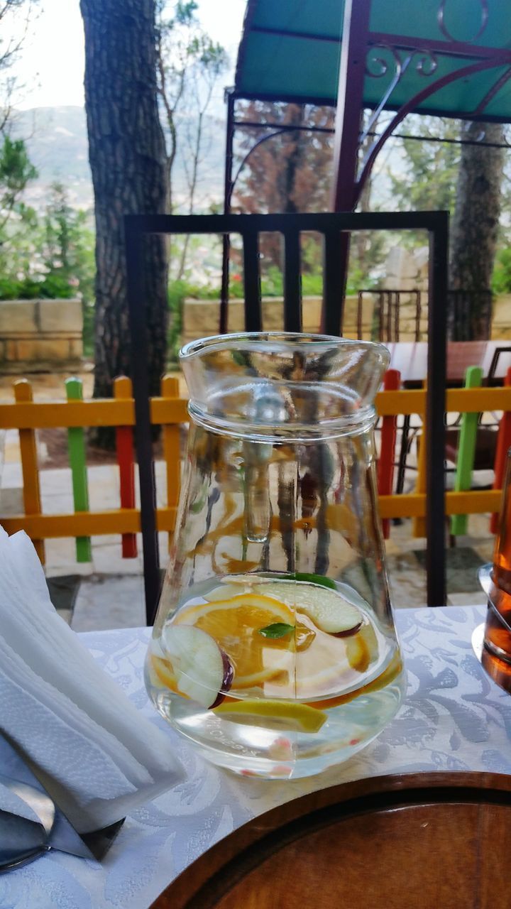 CLOSE-UP OF GLASSES ON TABLE