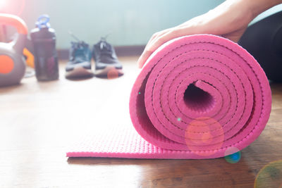 Close-up of pink shoes on table