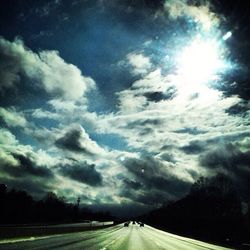 Road amidst landscape against sky