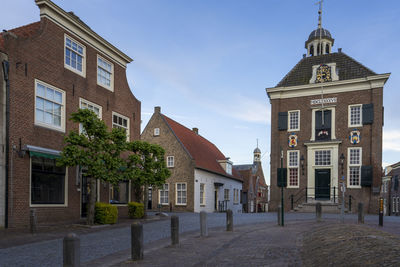 Exterior of buildings in city against sky