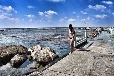 Scenic view of sea against cloudy sky
