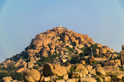 Rock formations on mountain against sky