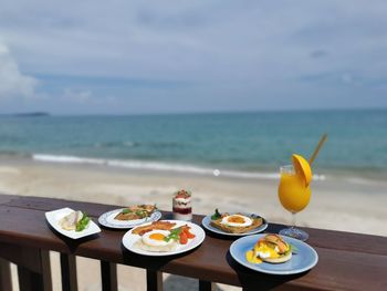 High angle view of breakfast on table against sea