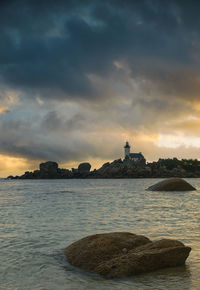 Dramatic sunrise at meneham lighthouse, brittany