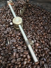 Close-up of roasted coffee beans in roaster