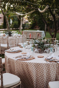 Empty chairs and tables in yard