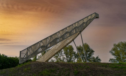 Low angle view of building against sky during sunset