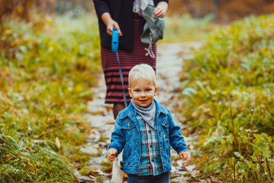 Full length of boy standing on field