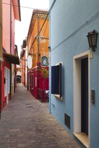 Street amidst buildings in city of caorle