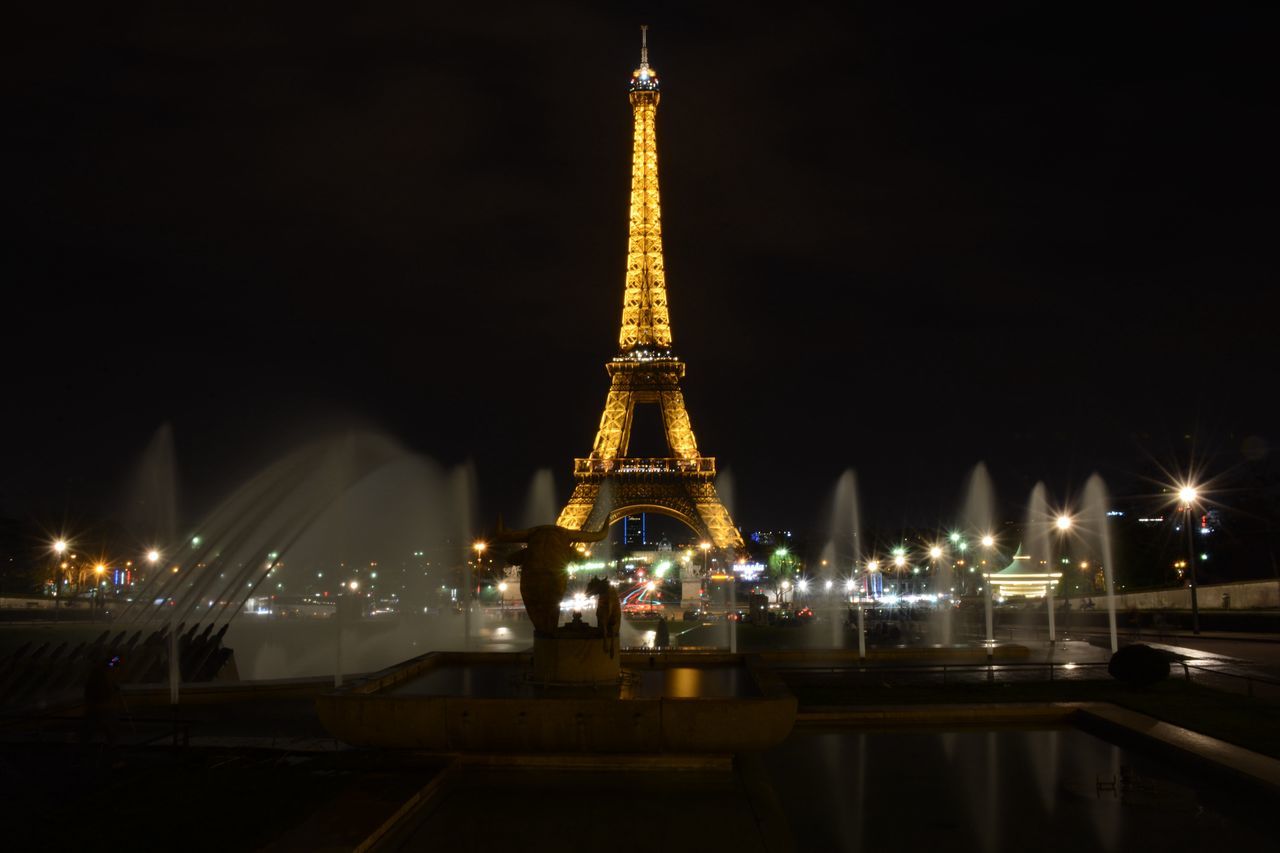 VIEW OF ILLUMINATED FERRIS WHEEL AT NIGHT